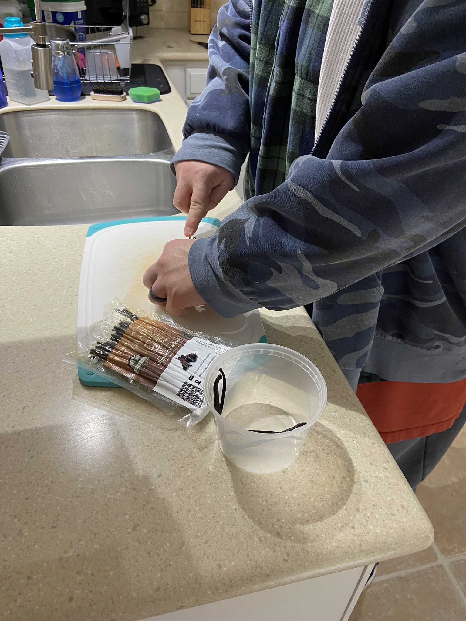 Demonstrating splitting a vanilla bean